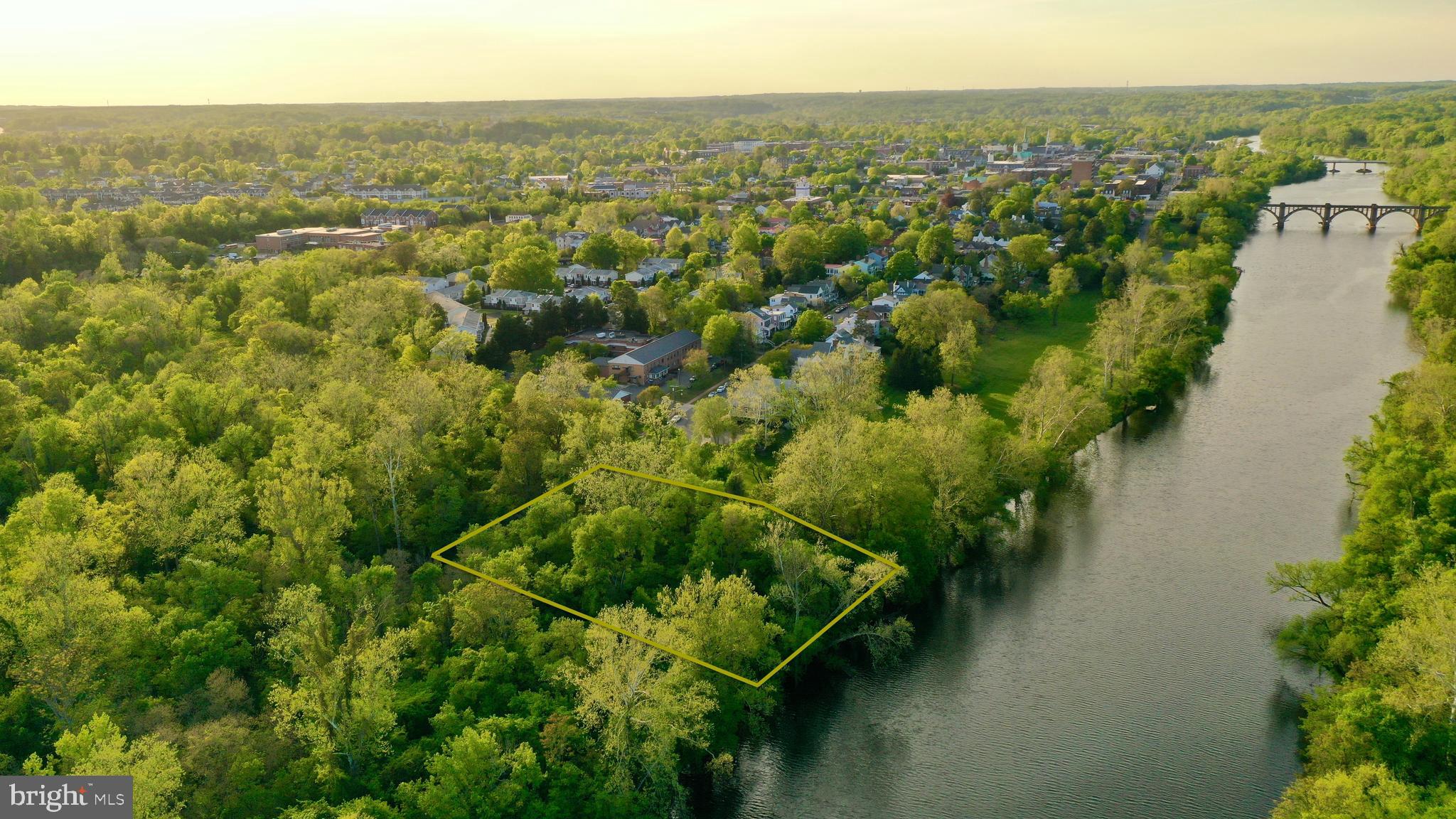 an aerial view of residential house with outdoor space and trees around