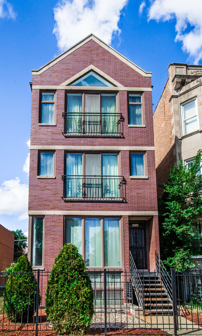 a front view of a house with glass windows