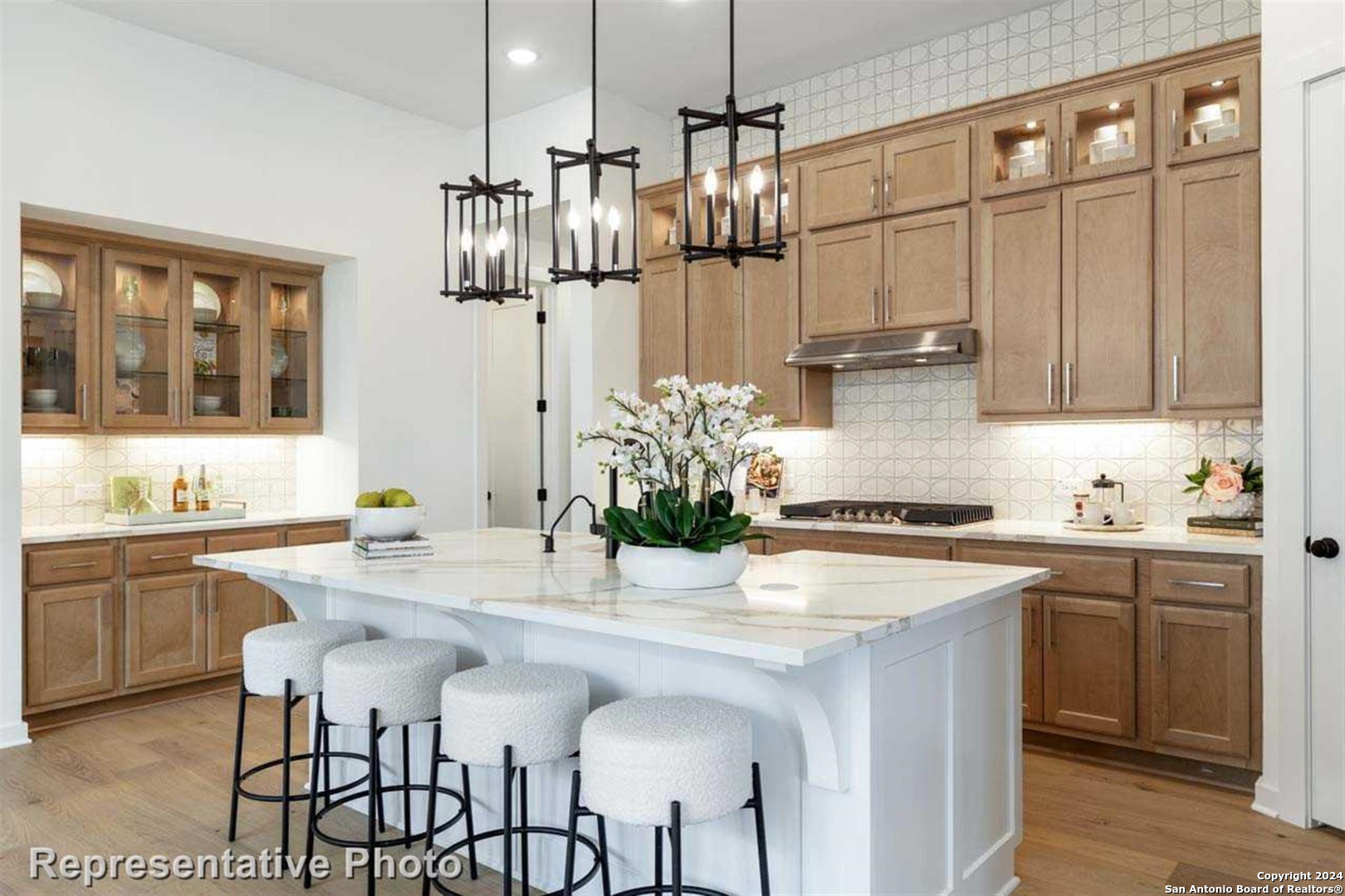 a kitchen with stainless steel appliances granite countertop a kitchen island a stove and a cabinets