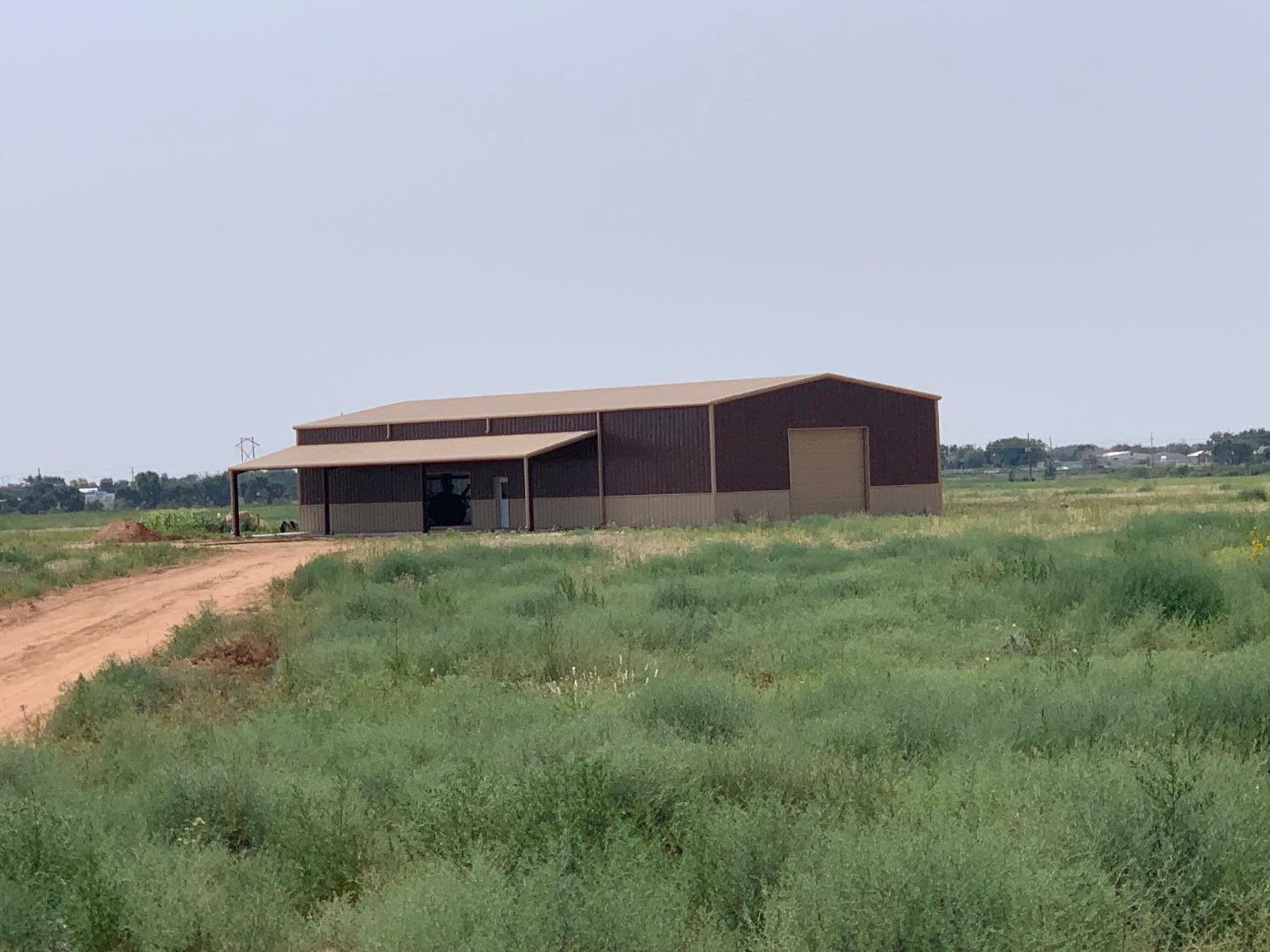 a view of a house with a yard and a car parked