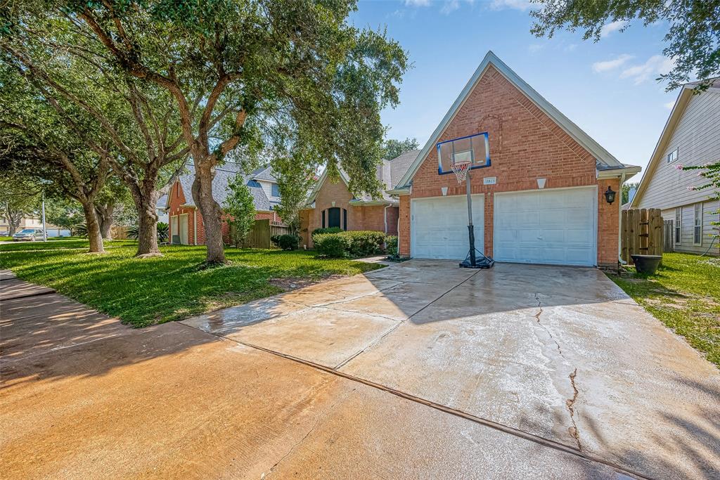 front view of a house next to a yard