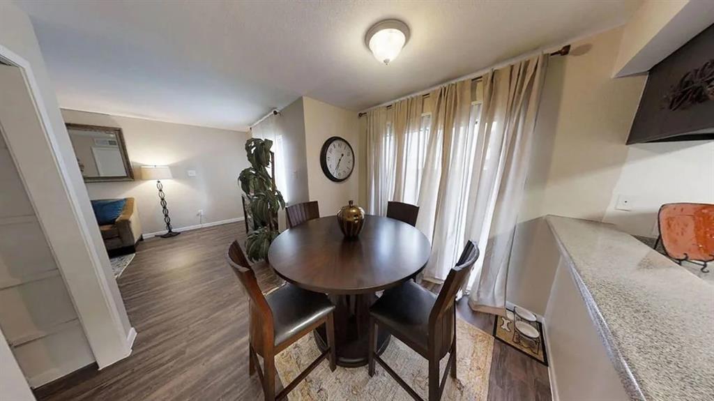 a view of a dining room with furniture and window