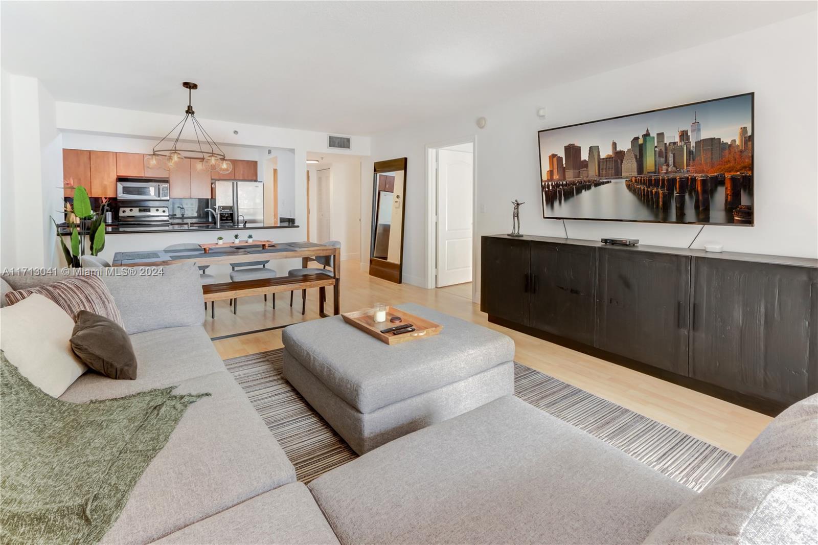 a living room with furniture and a painting