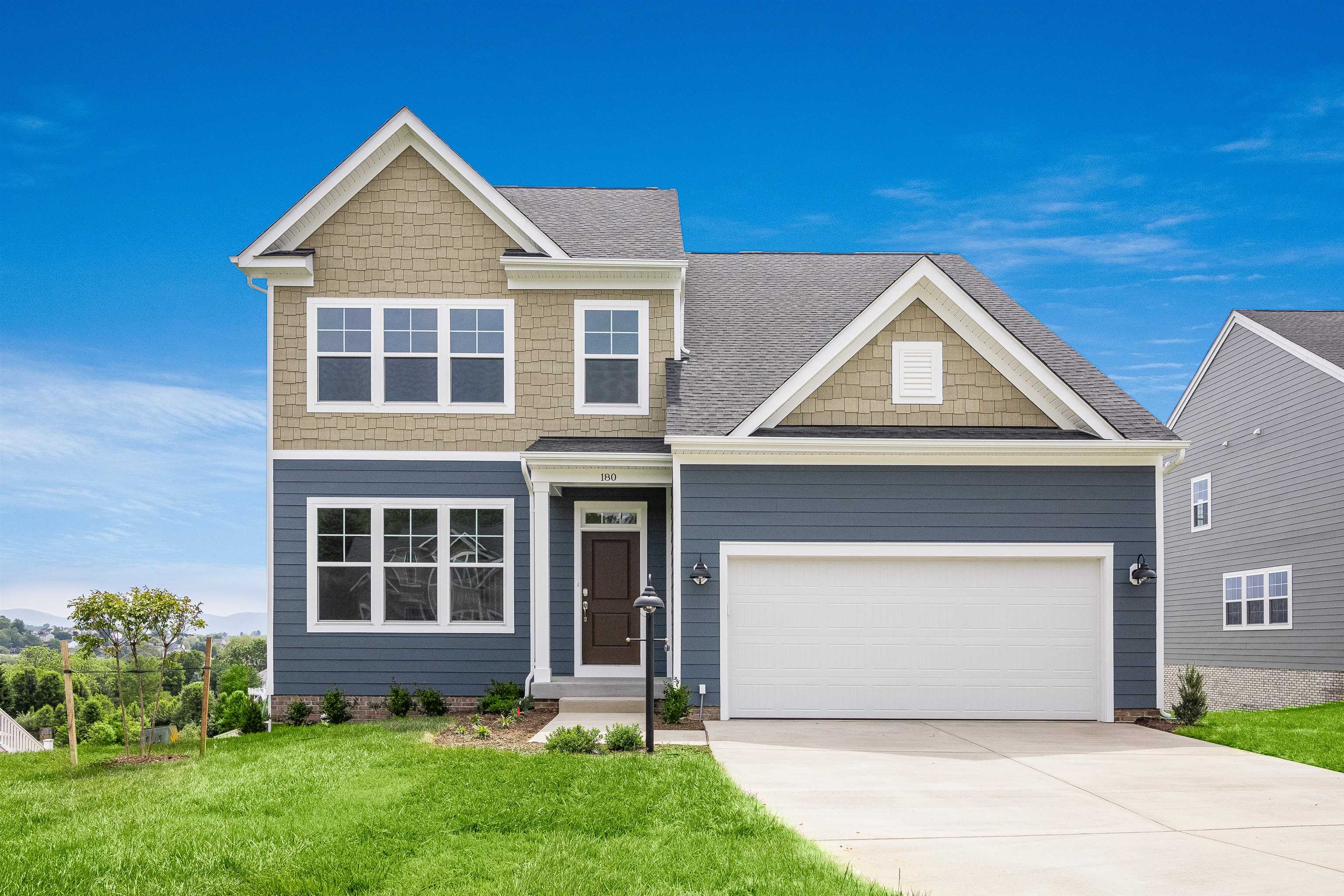 front view of a house with a yard