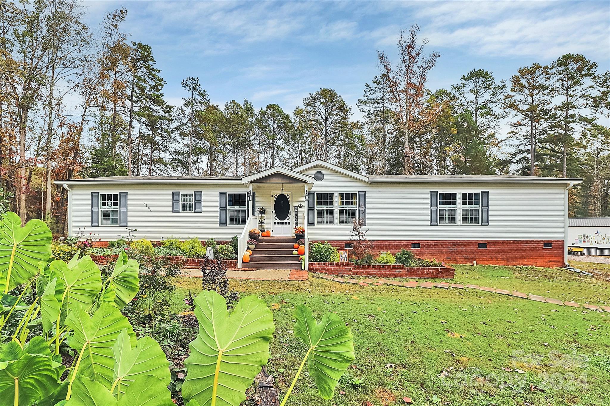 a front view of house with yard and seating area