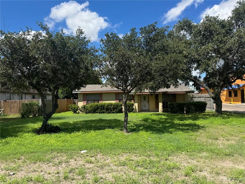 Ranch-style home with a front lawn