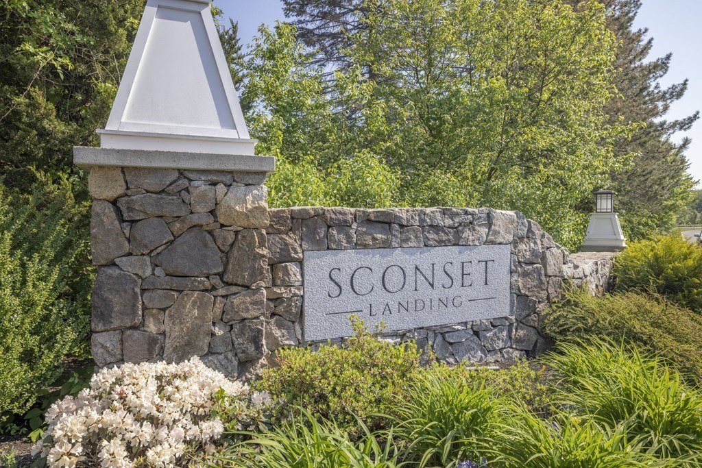 view of outdoor space with signage and flags