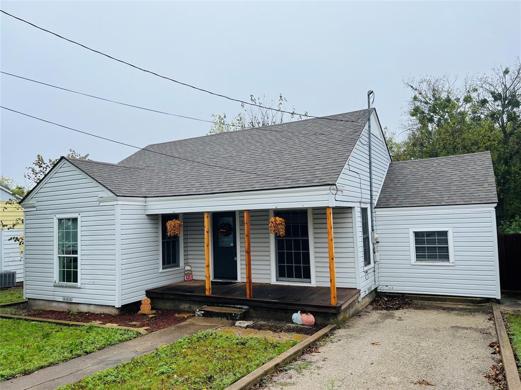 View of front of home featuring central air condition unit and a porch