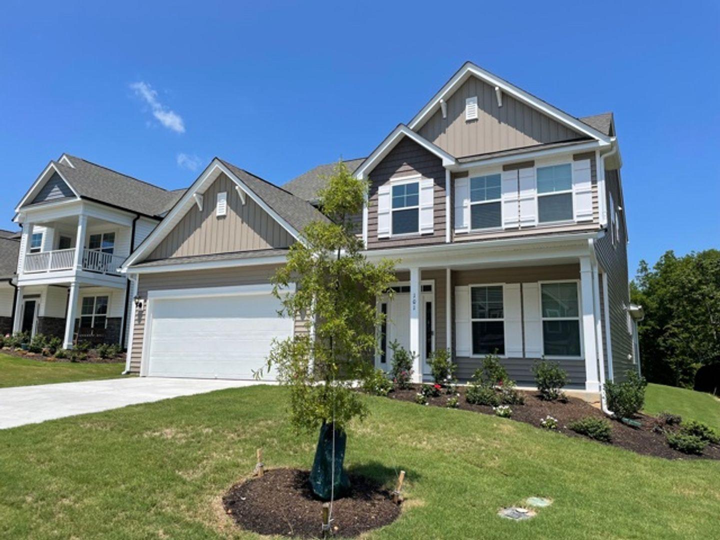 a front view of a house with a yard