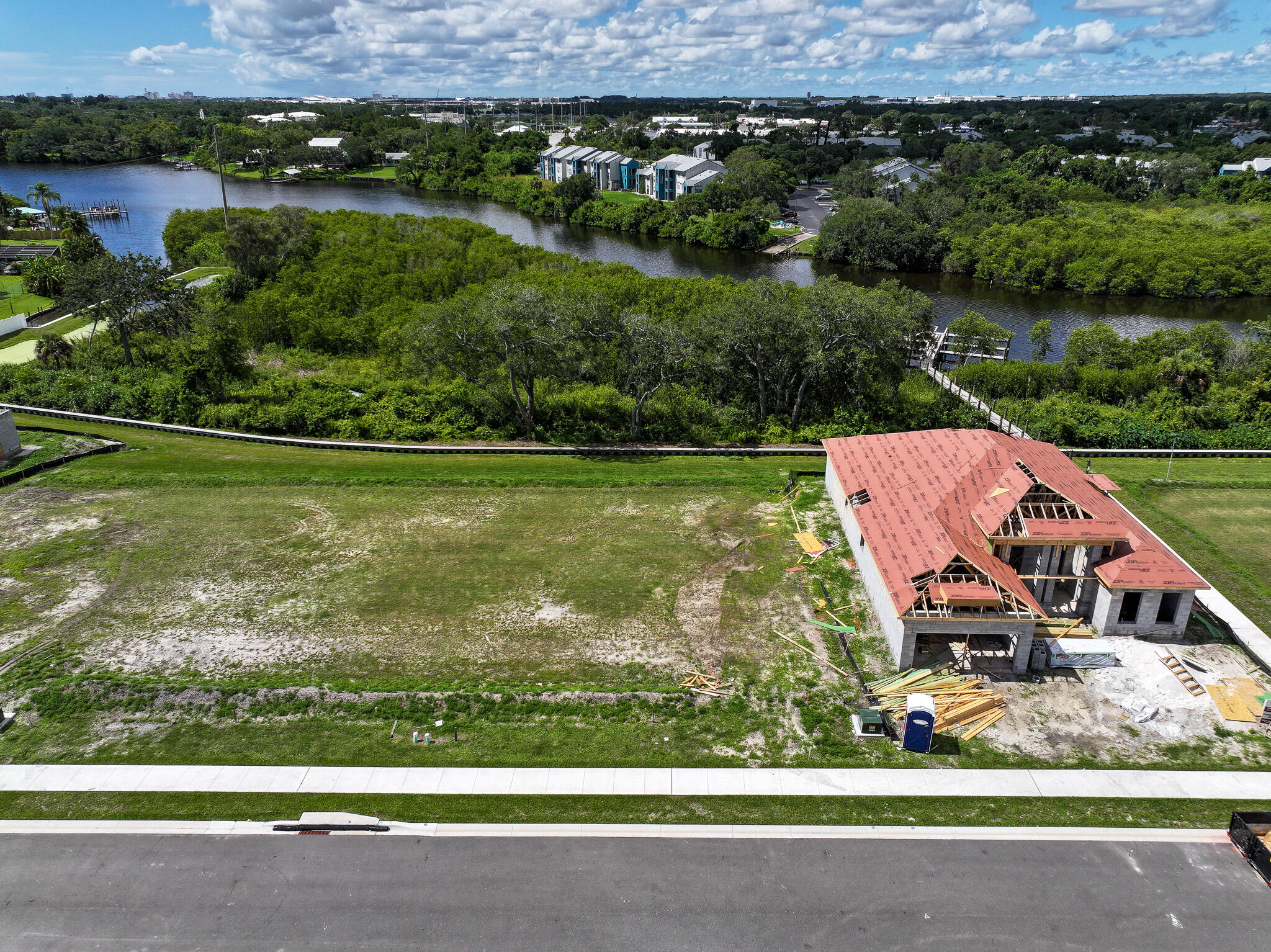 an aerial view of a house with a yard basket ball court and outdoor seating