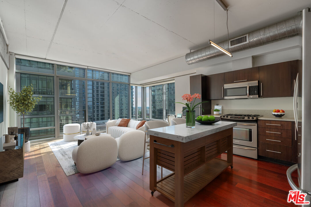 a room with furniture wooden floor and window