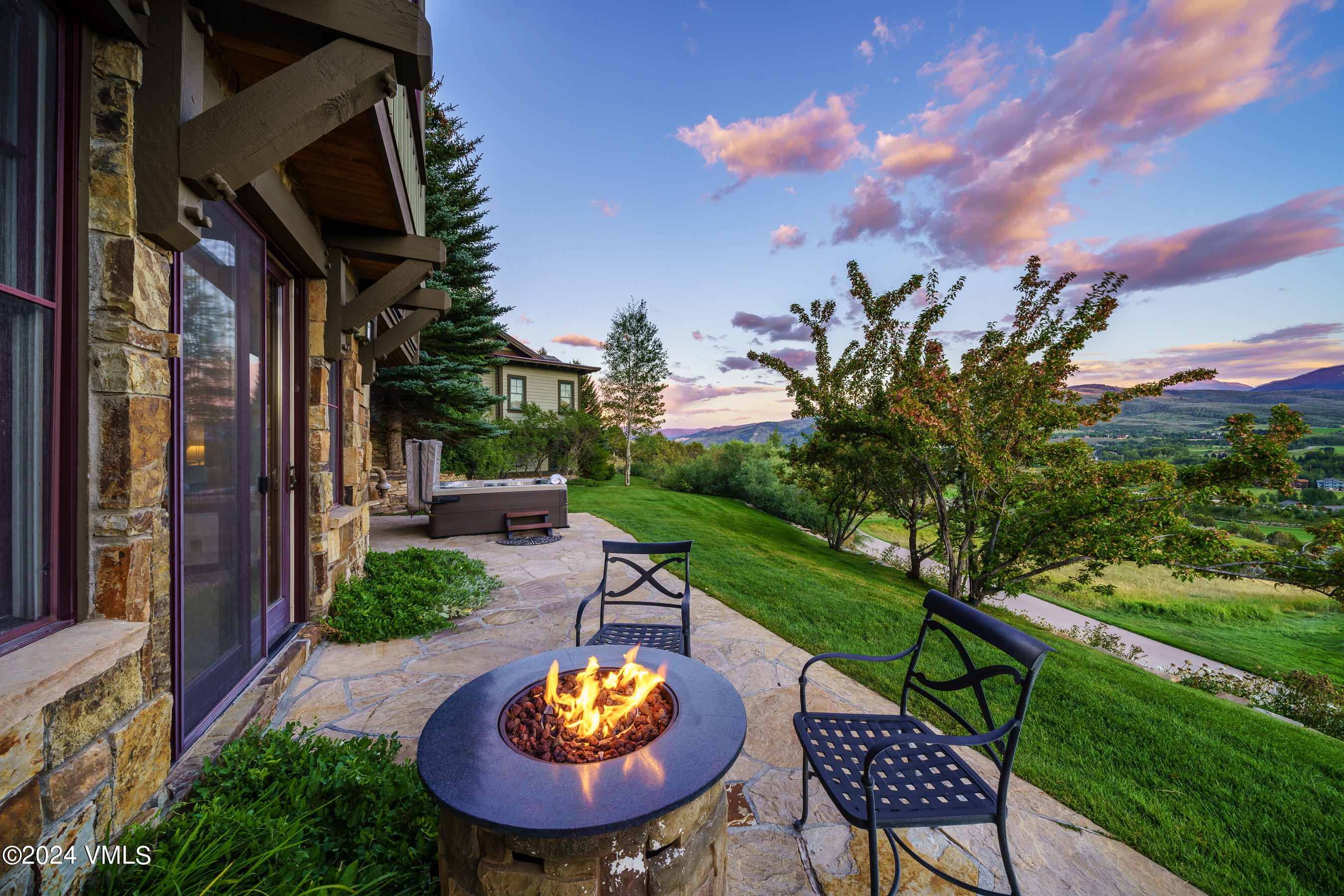 a view of a swimming pool with a patio and a yard