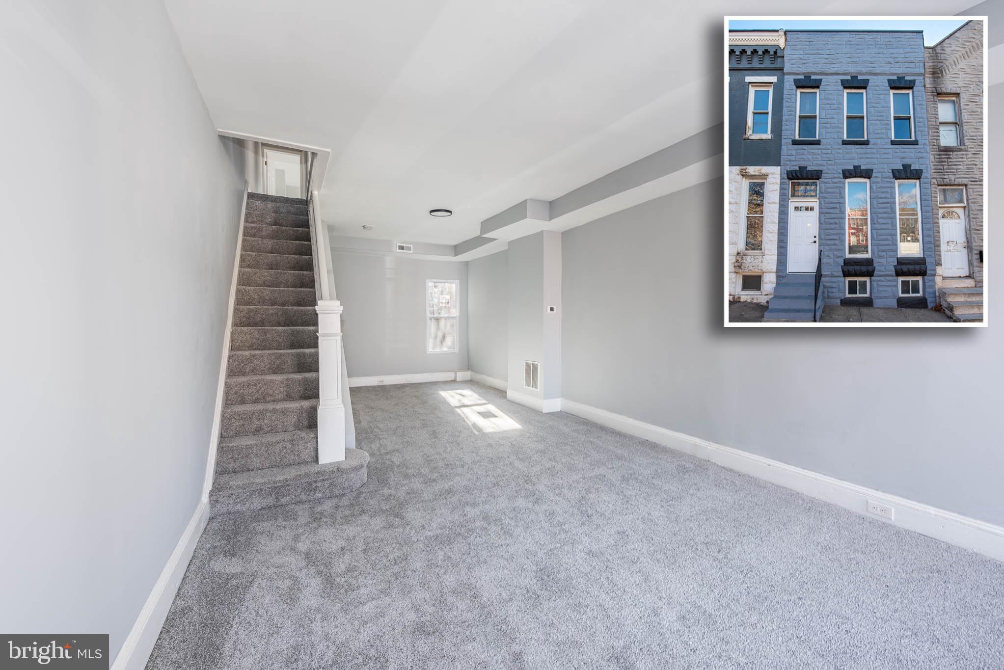 a view of an empty room with stairs