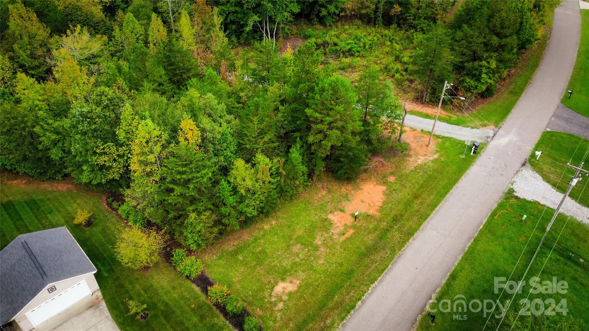 a view of a lake with a yard