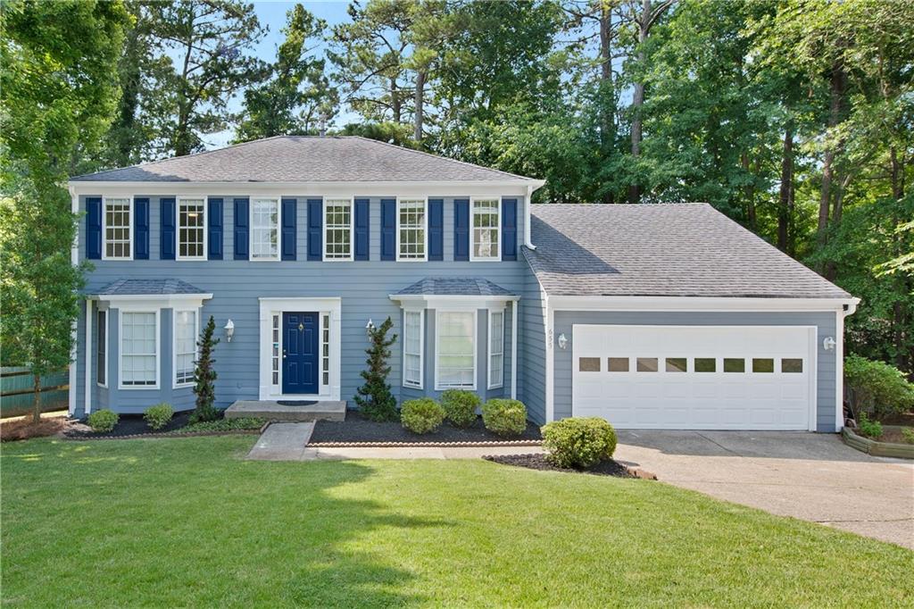 front view of a house with a yard