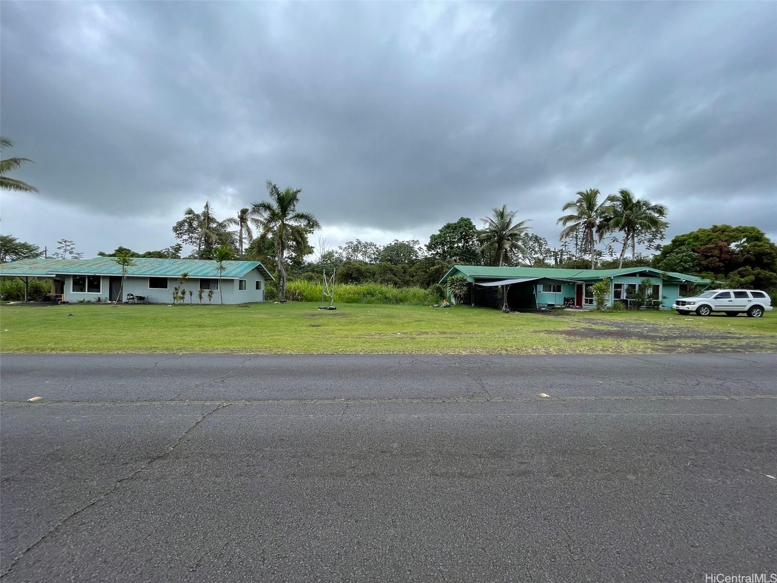 a view of a big house with a big yard