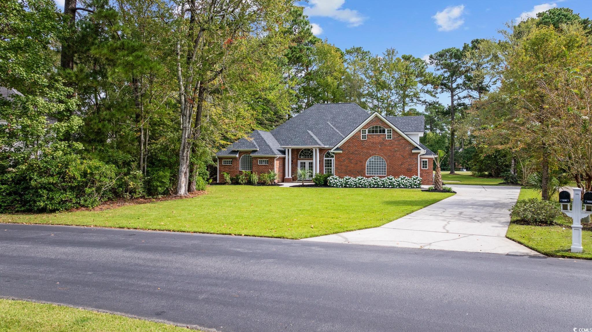 View of front of property featuring a front lawn