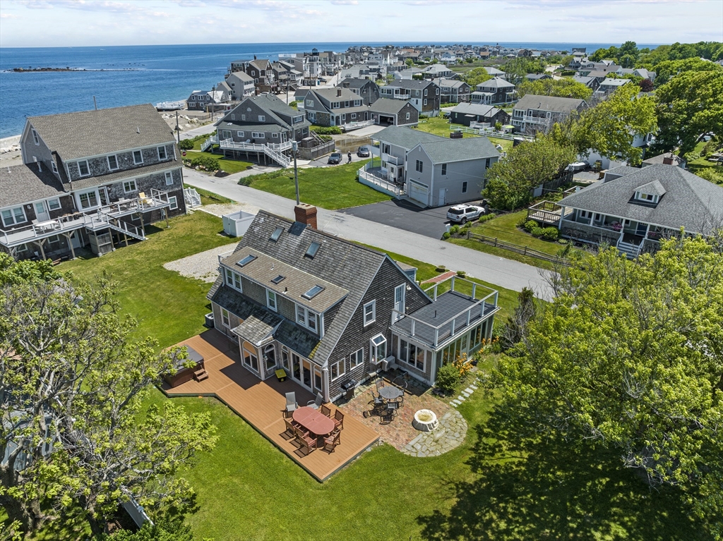 an aerial view of a house with a garden and trees