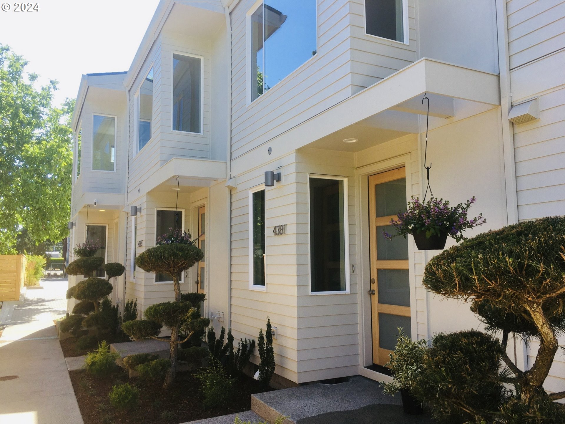 a front view of a house with yard