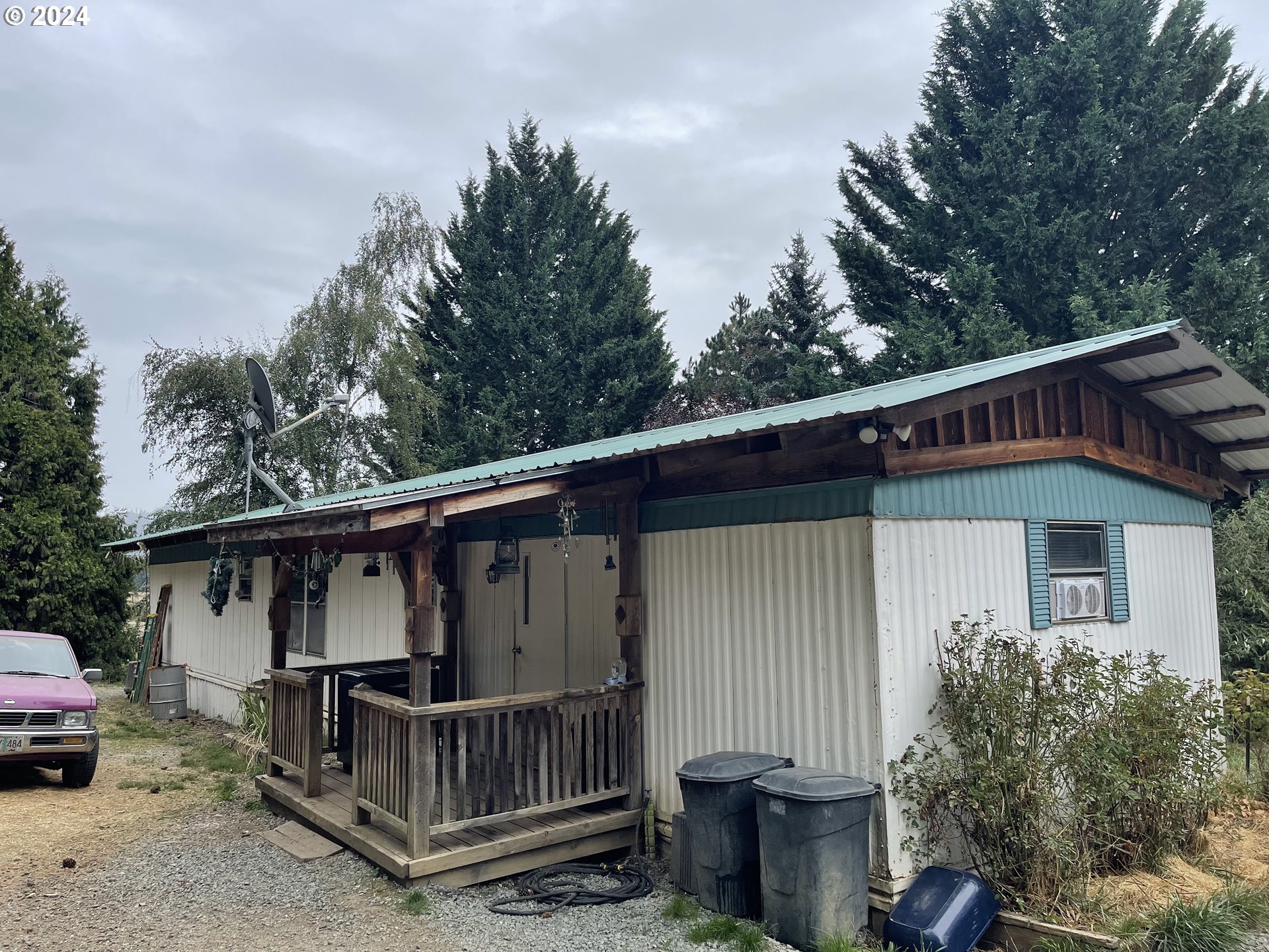 a view of a house with a yard and deck