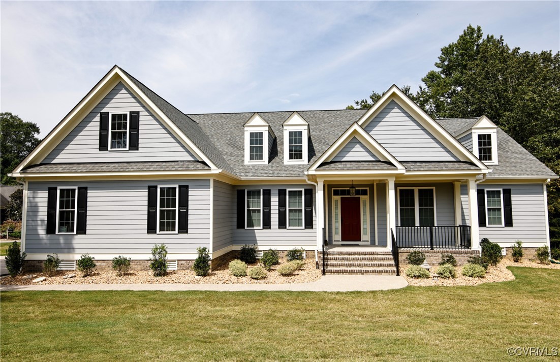 a front view of a house with swimming pool and porch