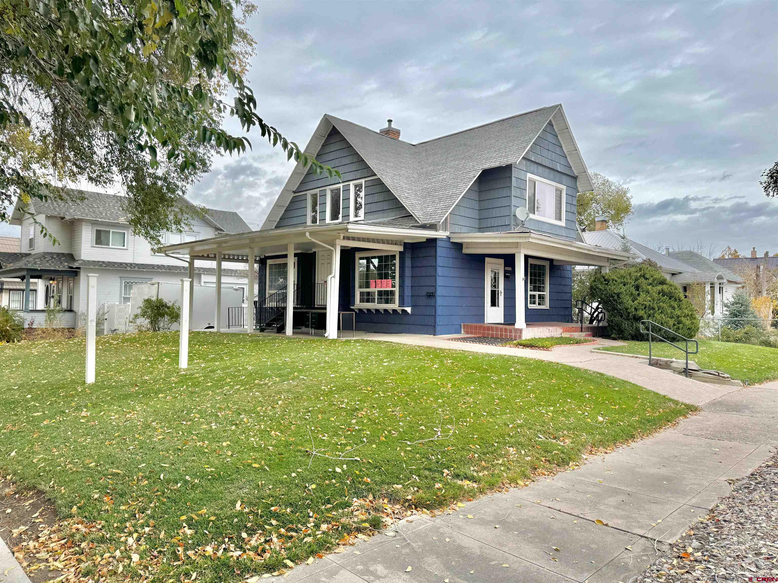 front view of a house with a yard