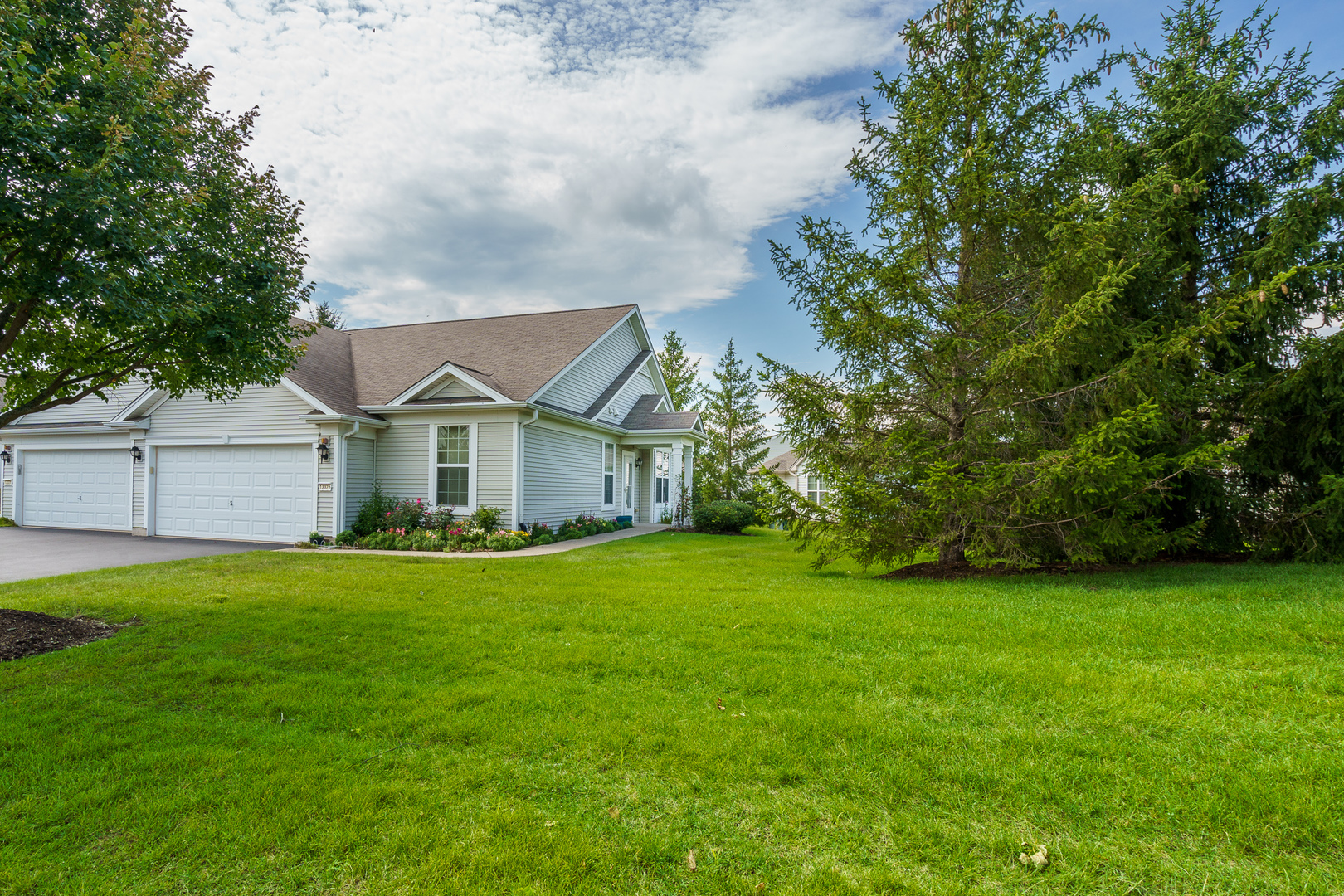 a front view of a house with a yard