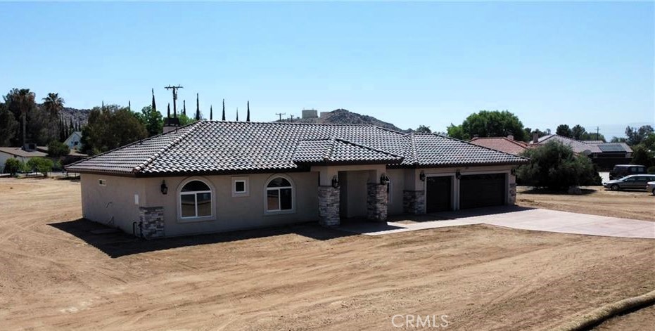 a front view of a house with a wooden fence