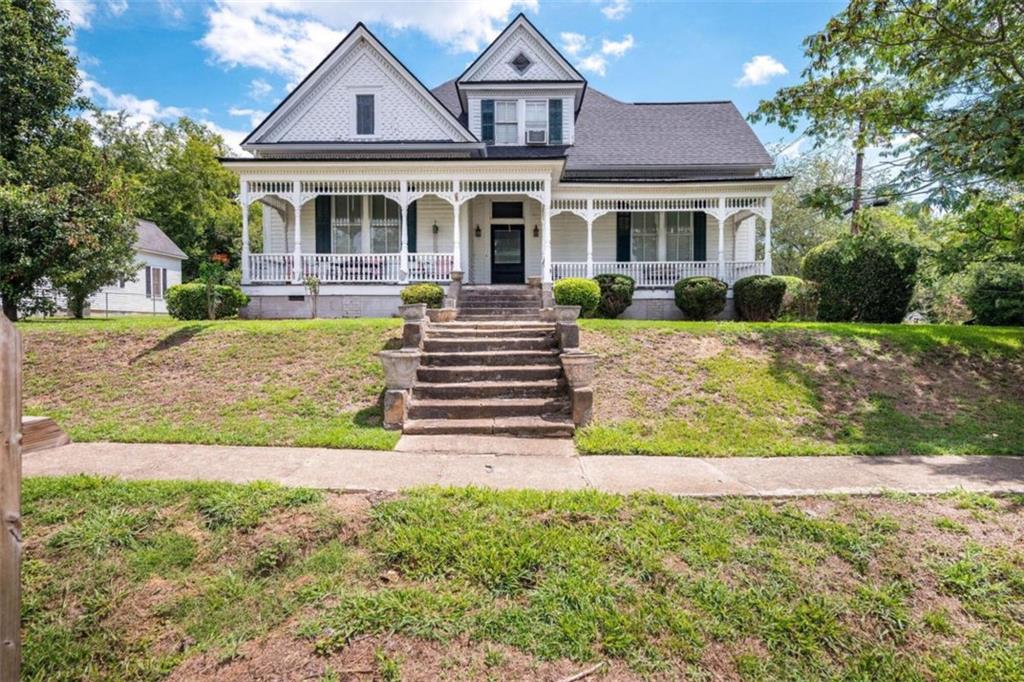 front view of a house with a yard