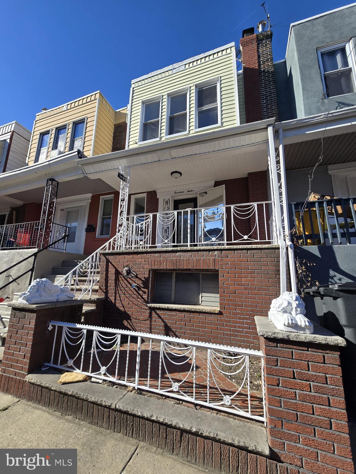 a front view of residential houses with stairs