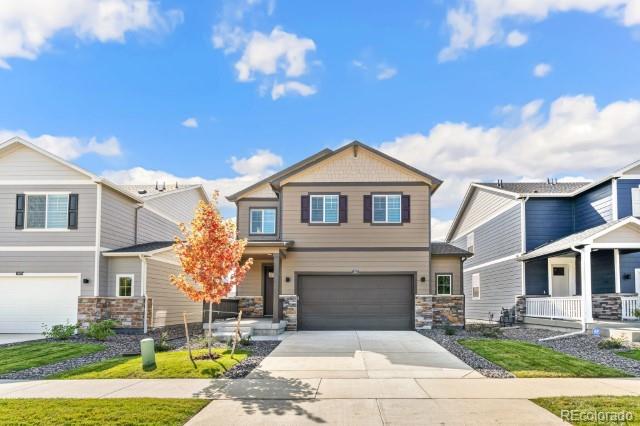 a front view of a house with a yard outdoor seating and yard