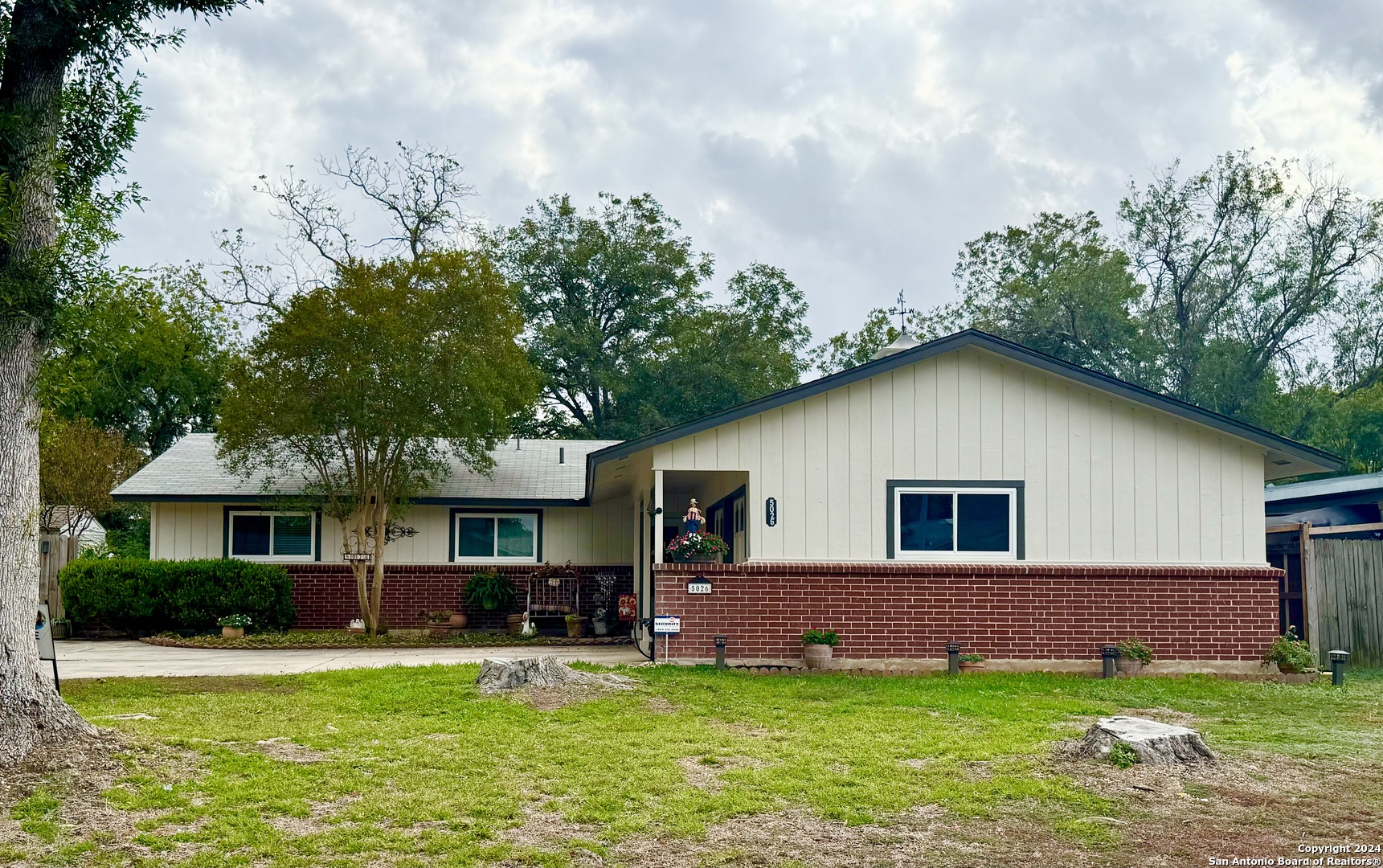 a view of a house with a yard porch and sitting area