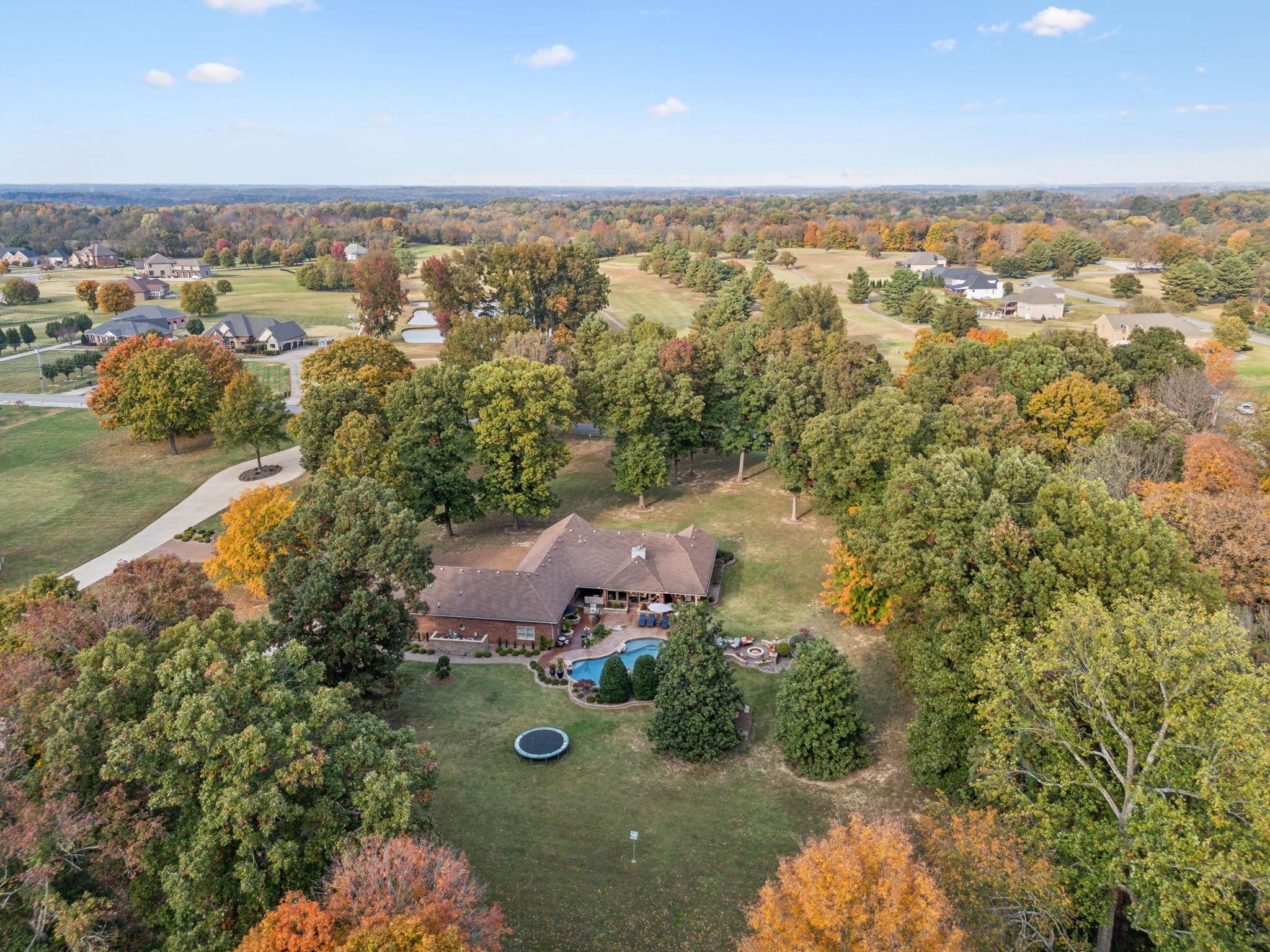 an aerial view of a houses with a yard