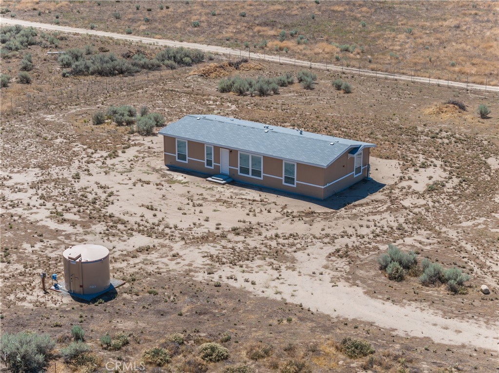 a view of a big house with a yard