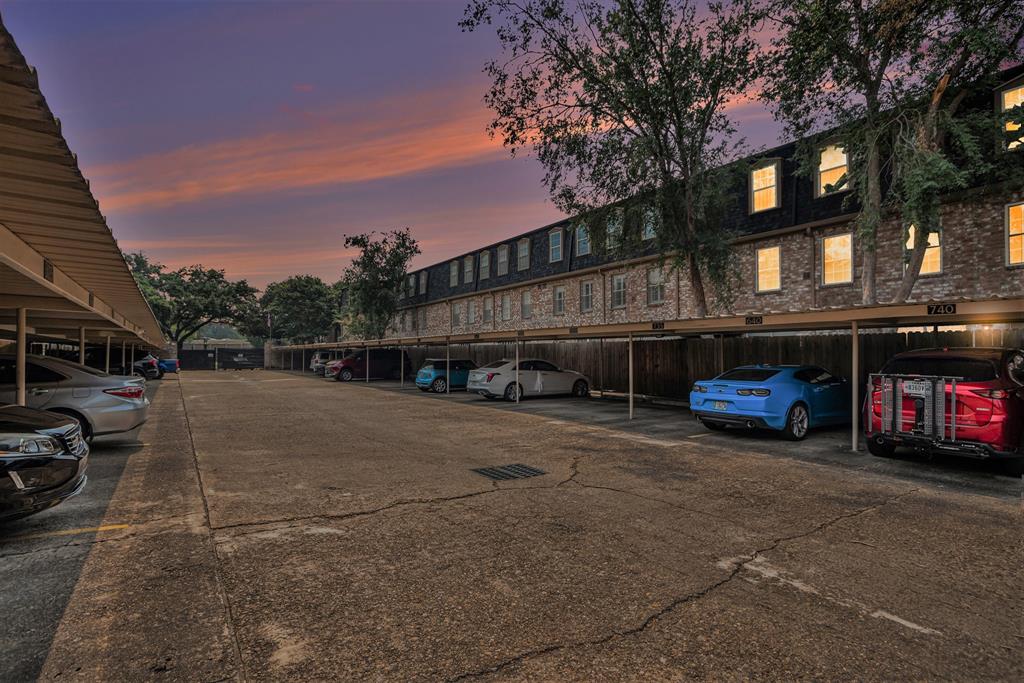 a view of street with parked cars