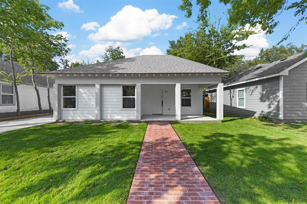 a front view of a house with yard