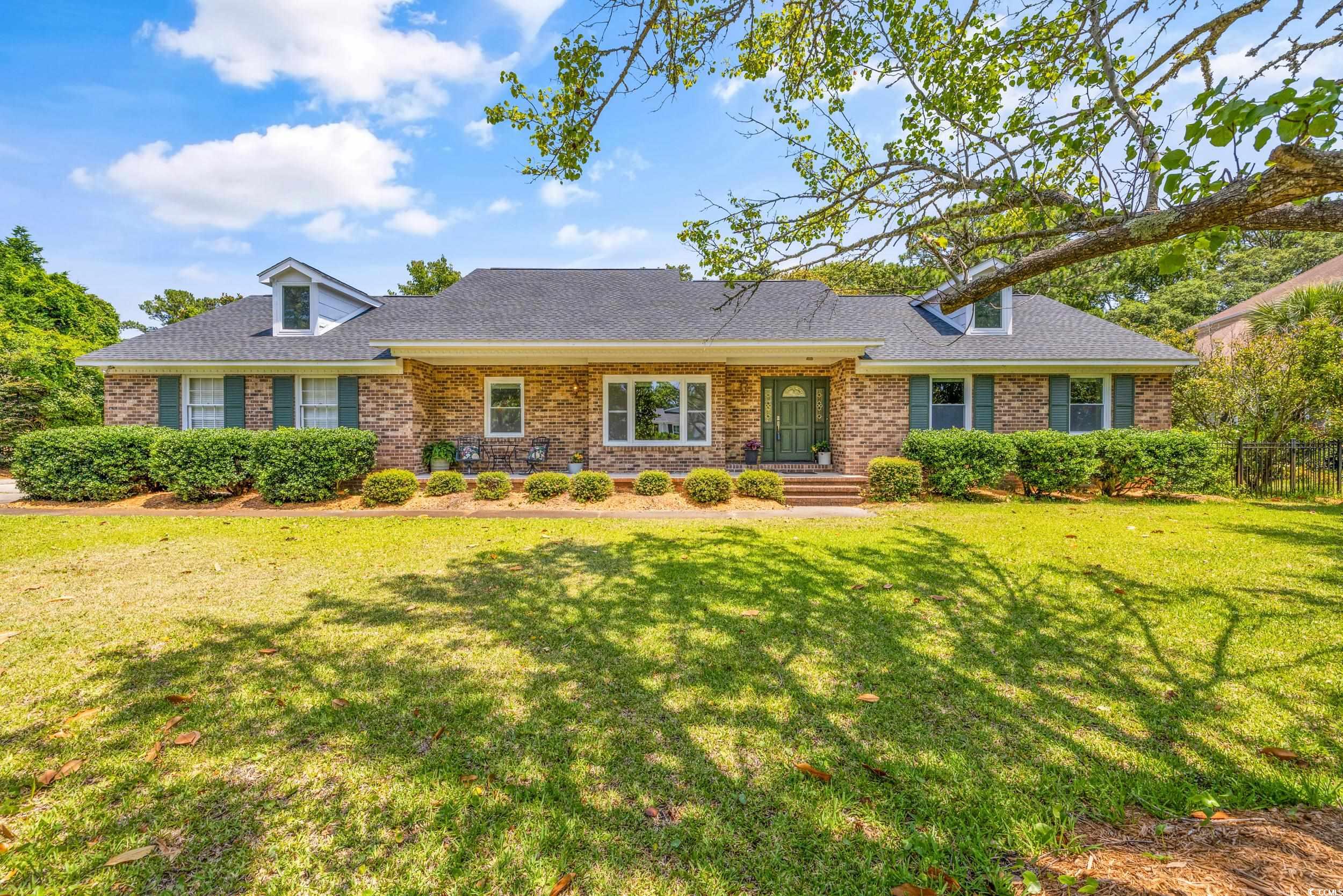 Ranch-style home with a front yard