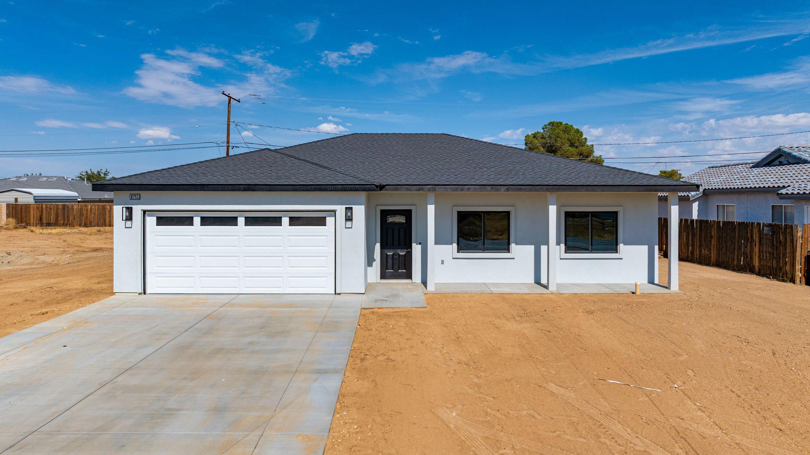 a house with yard in front of it