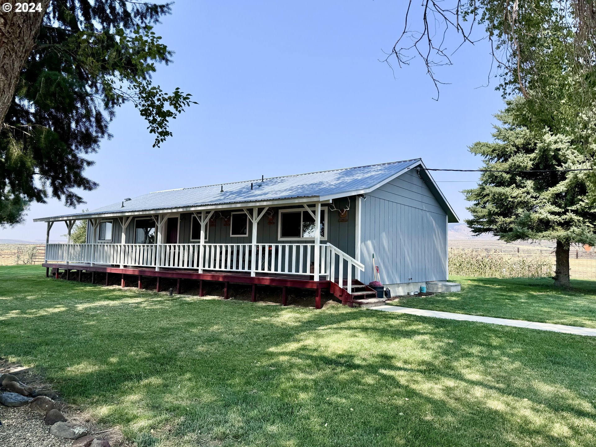 a view of front of house with a yard