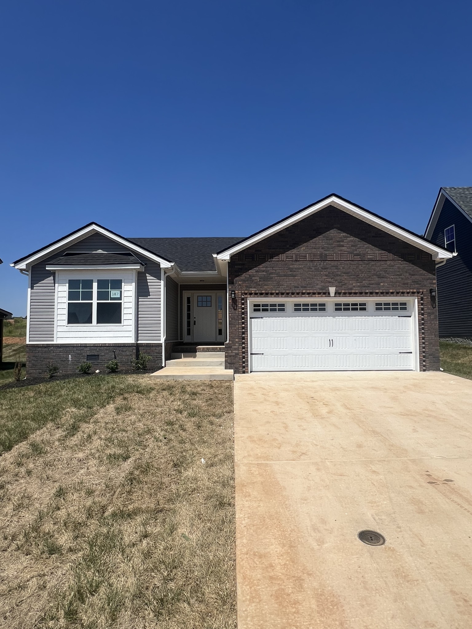 a front view of a house with a yard