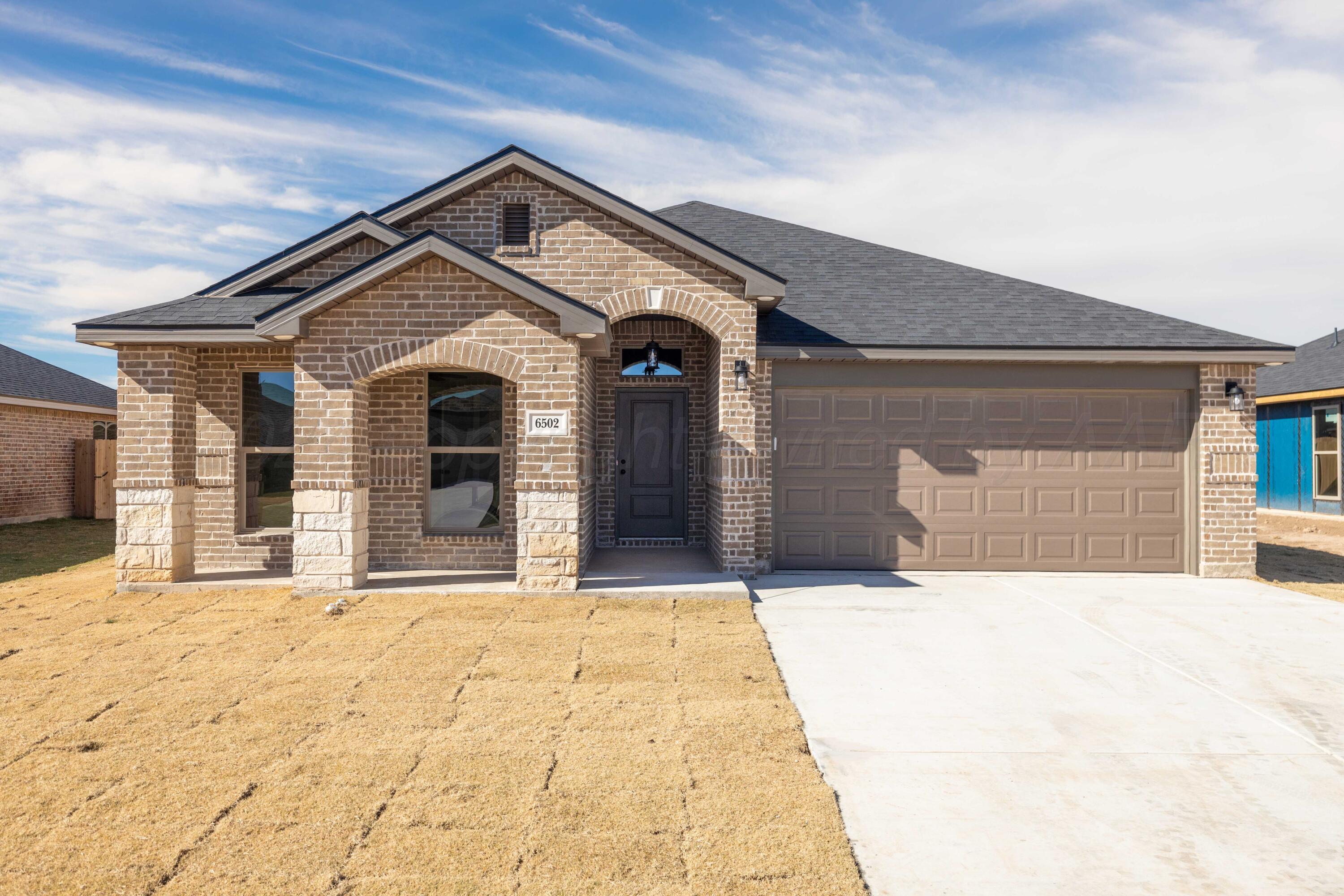 a front view of a house with a outdoor space