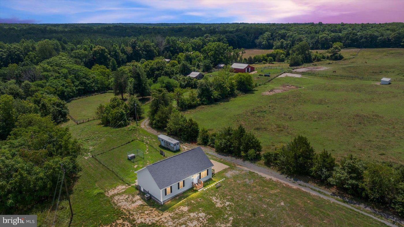 an aerial view of a house with a garden