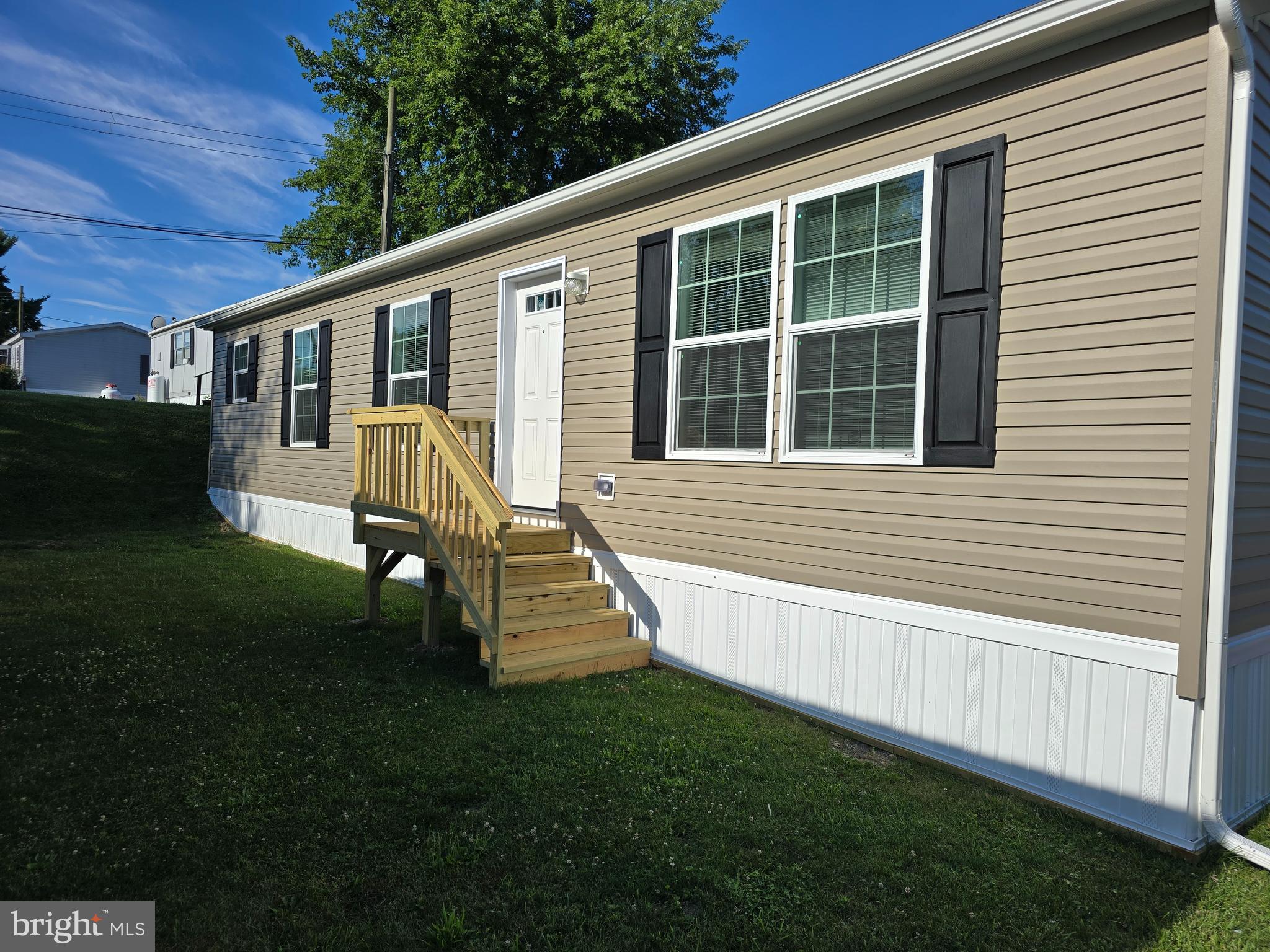 a view of house with backyard