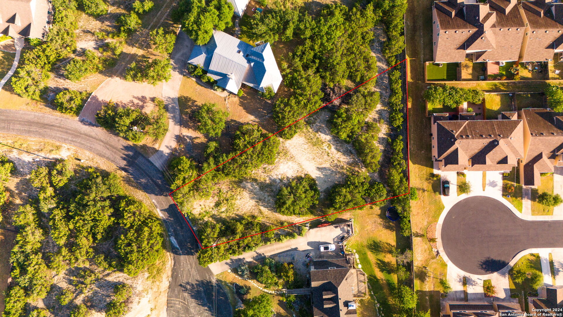 an aerial view of residential house with pool and yard