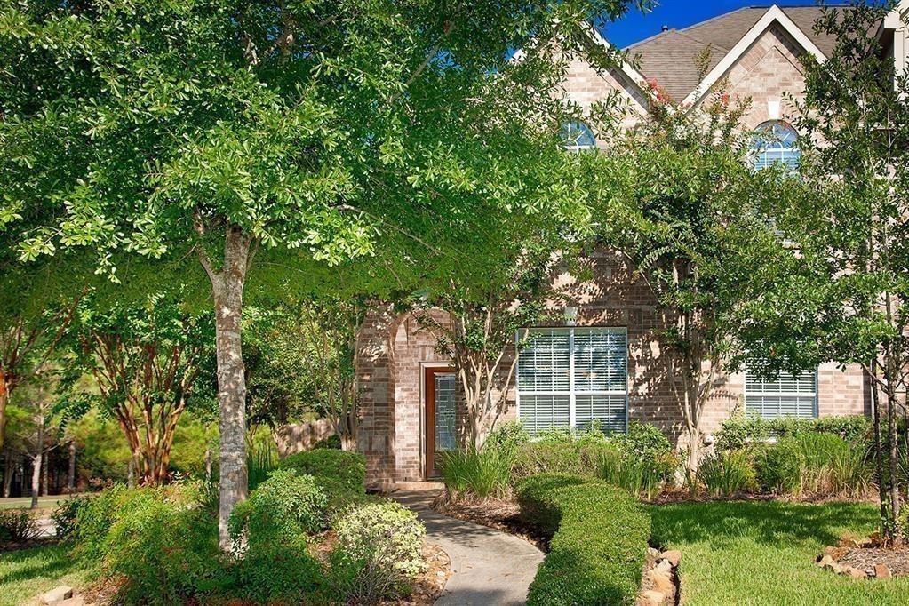 front view of a house with a tree