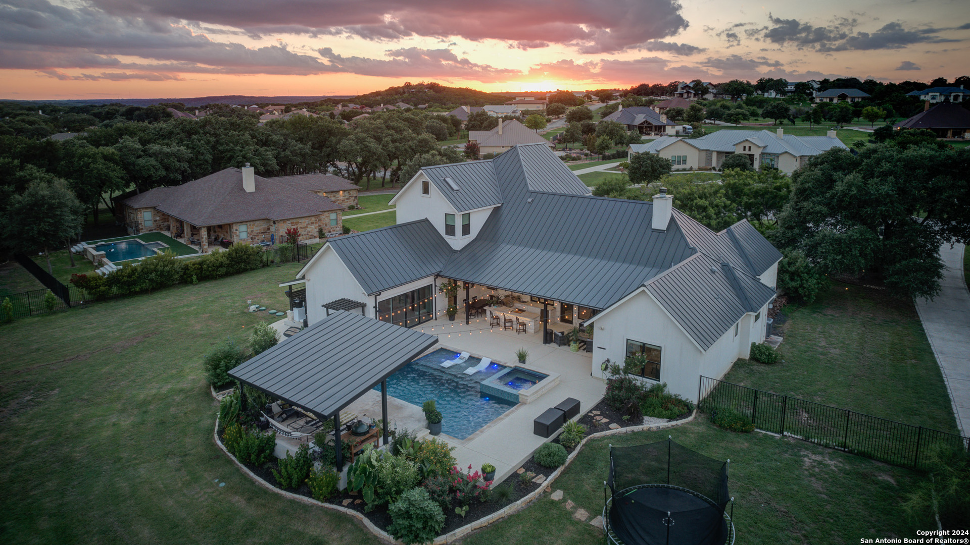 an aerial view of a house with a garden