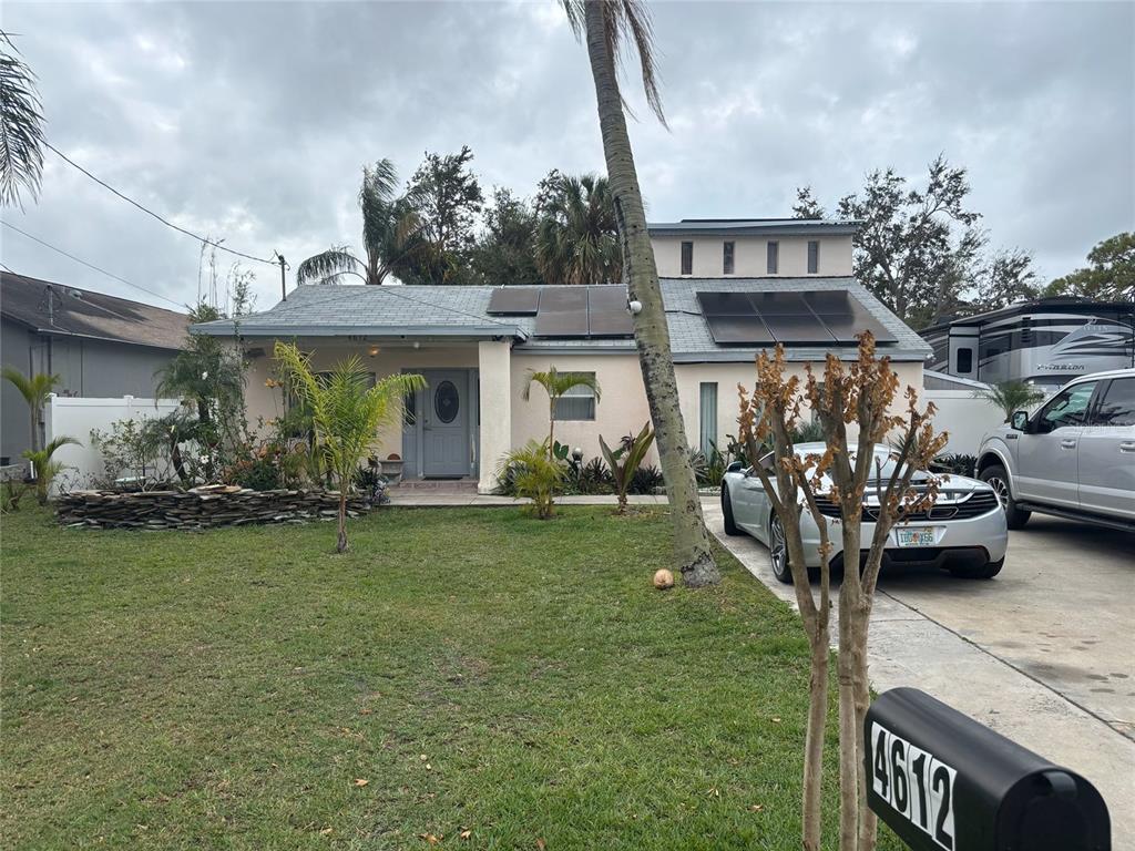 a front view of a house with garden