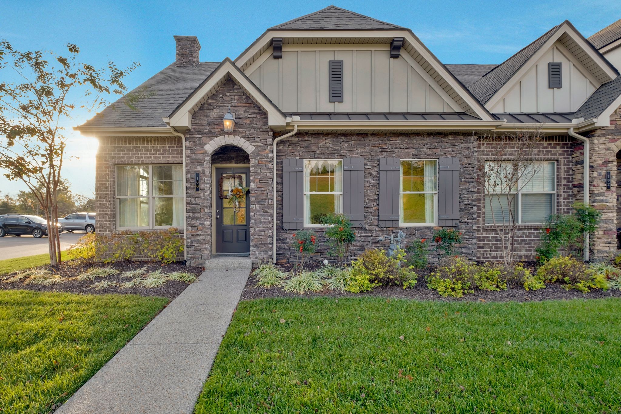 a front view of a house with garden