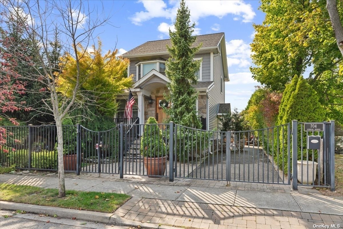 a view of a house with a small yard and plants