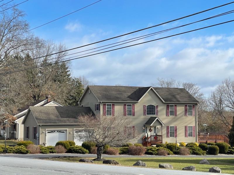 Colonial-style house with a garage